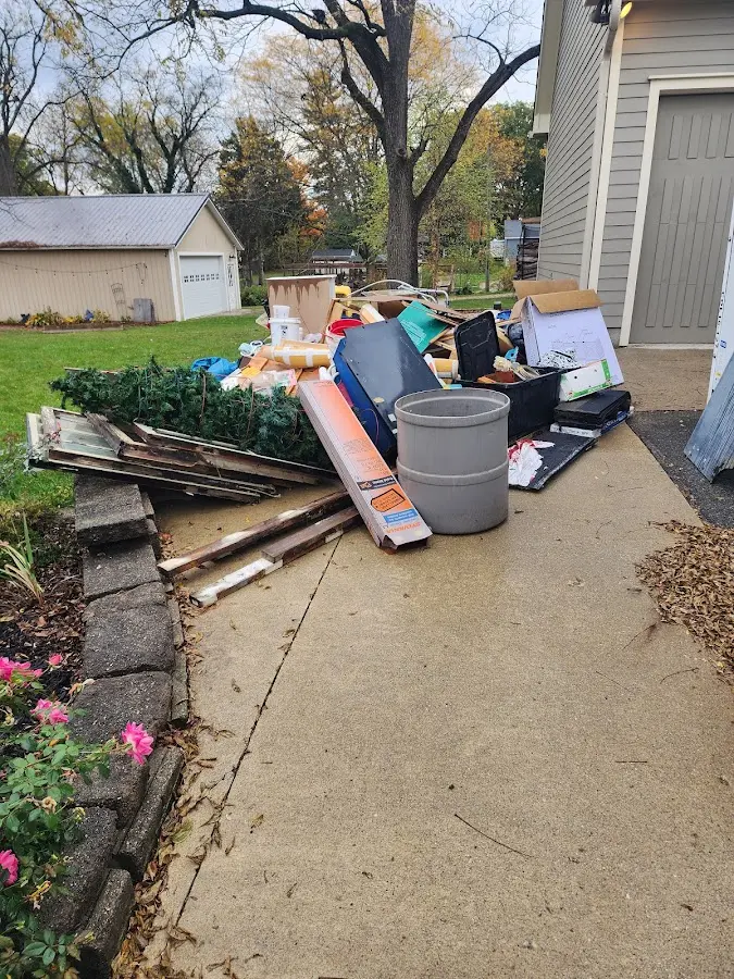 Dumpster being loaded with debris for 30 Yard Dumpster Rental in Jersey Shore
